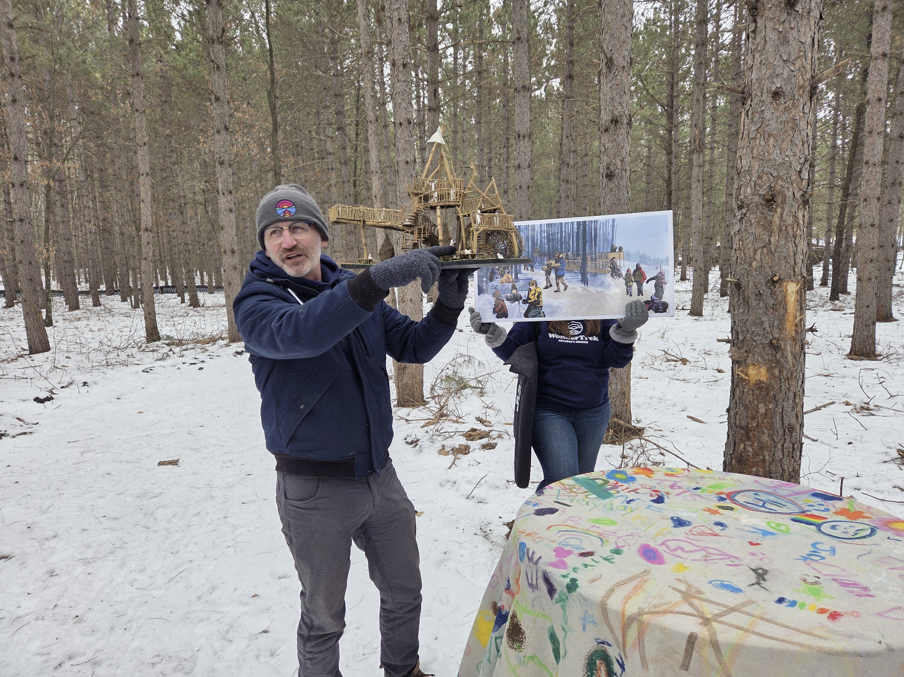 Peter holding treehouse on site tour
